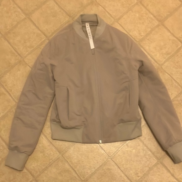 Lululemon bomber jacket size 4. Nylon lining inside. Beige color. - Picture 1 of 3